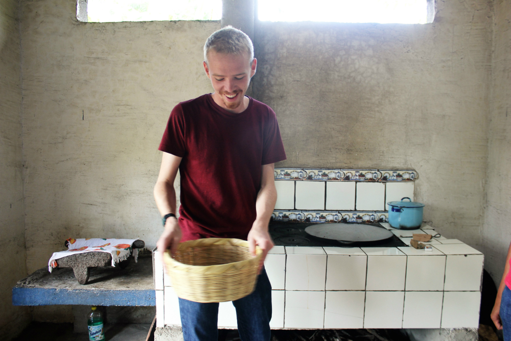 peanut-butter-workshop-with-de-la-gente-antigua-guatemala-charlie-on-travel-luke-shaking-peanuts