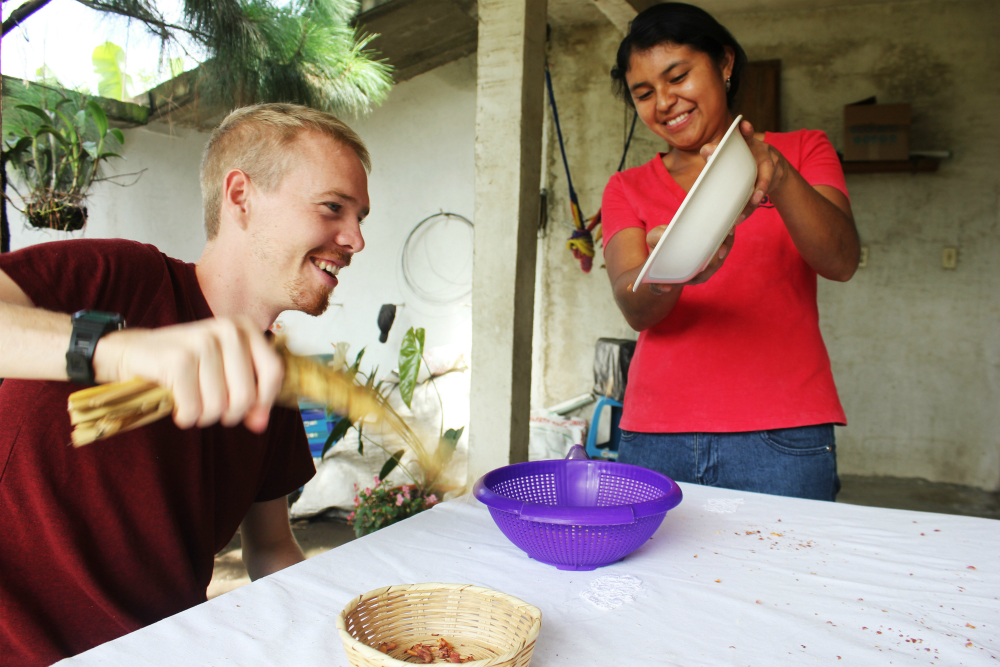 peanut-butter-workshop-with-de-la-gente-antigua-guatemala-charlie-on-travel-fanning-peanuts