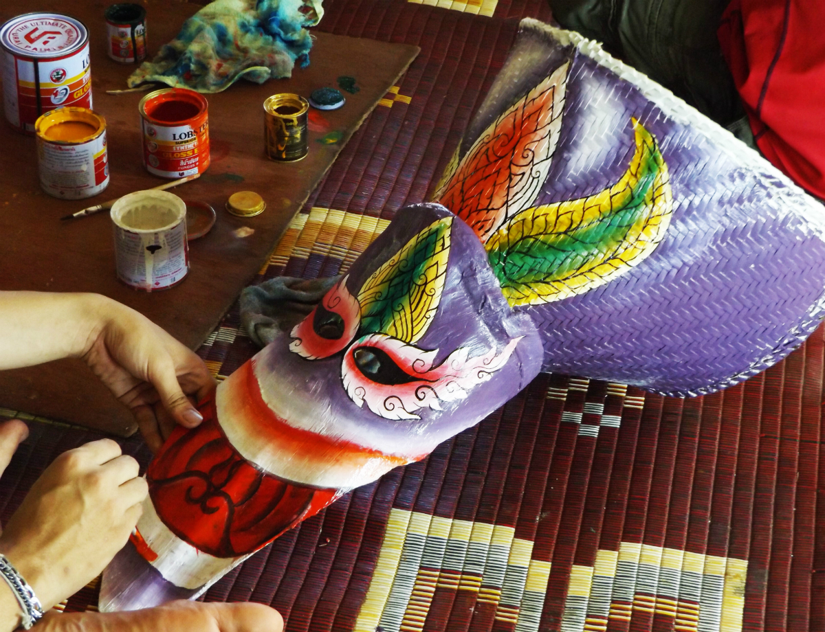 Painting mask at Phi Ta Khon Festival Thailand 
