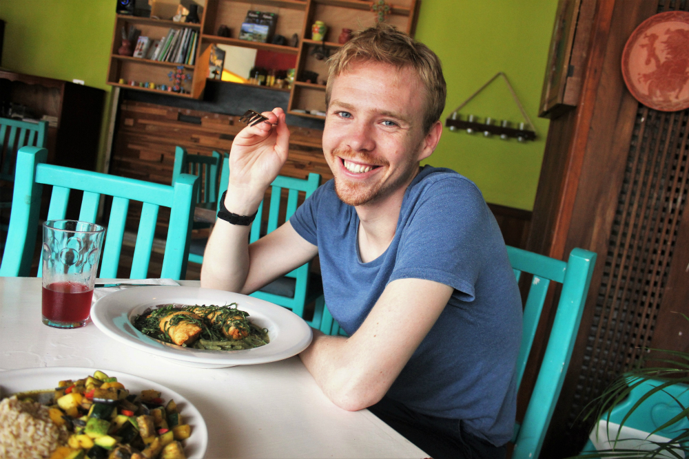 Luke in a vegan restaurant in Tulum Mexico - Charlie on Travel
